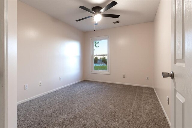 5916 NE Turquoise Dr, Lees Summit, MO 64064 - unfurnished room featuring carpet floors, a ceiling fan, and baseboards