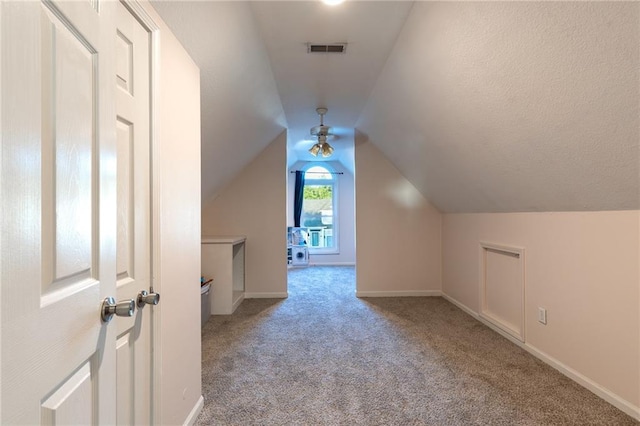 5916 NE Turquoise Dr, Lees Summit, MO 64064 - additional living space featuring carpet floors, vaulted ceiling, and baseboards