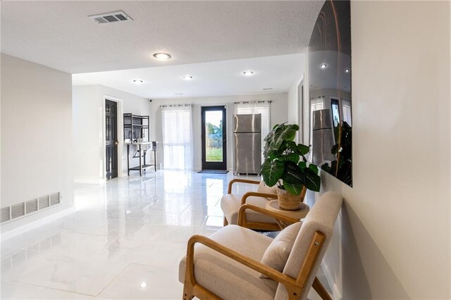 5916 NE Turquoise Dr, Lees Summit, MO 64064 - lobby with recessed lighting and a textured ceiling