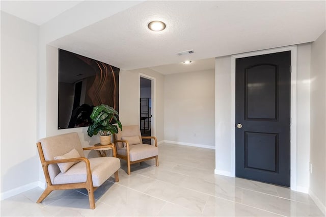 5916 NE Turquoise Dr, Lees Summit, MO 64064 - living area with baseboards and a textured ceiling