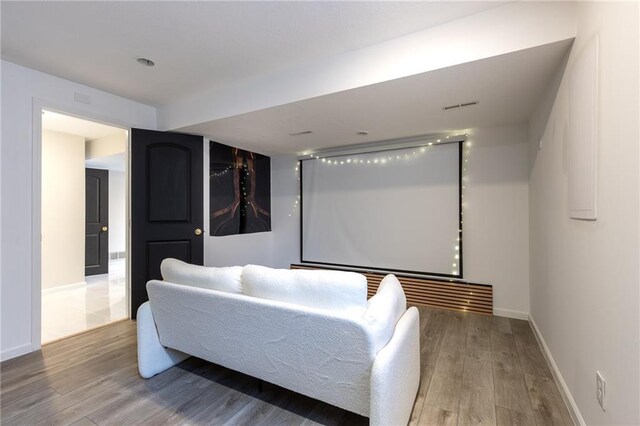5916 NE Turquoise Dr, Lees Summit, MO 64064 - home theater room featuring wood finished floors and baseboards