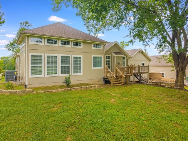 1955 Birmingham Rd, Liberty, MO 64068 - back of property featuring a lawn, a deck, roof with shingles, and stairway