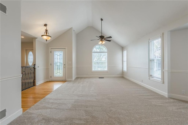1955 Birmingham Rd, Liberty, MO 64068 - spare room with ceiling fan, healthy amount of natural light, vaulted ceiling, and light carpet