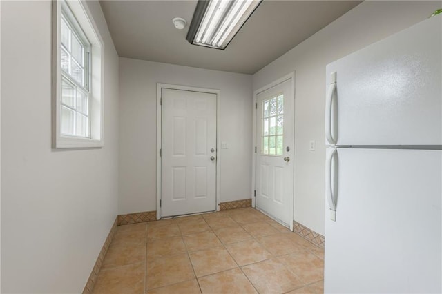 1955 Birmingham Rd, Liberty, MO 64068 - doorway to outside with baseboards and light tile patterned floors