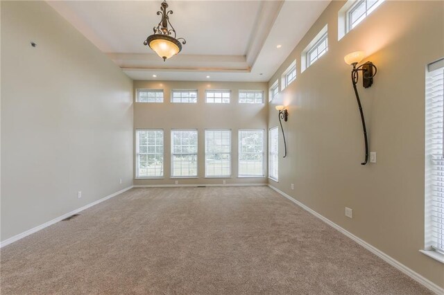 1955 Birmingham Rd, Liberty, MO 64068 - carpeted empty room featuring healthy amount of natural light, recessed lighting, and a towering ceiling