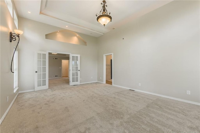 1955 Birmingham Rd, Liberty, MO 64068 - unfurnished bedroom with french doors, carpet, a high ceiling, and recessed lighting