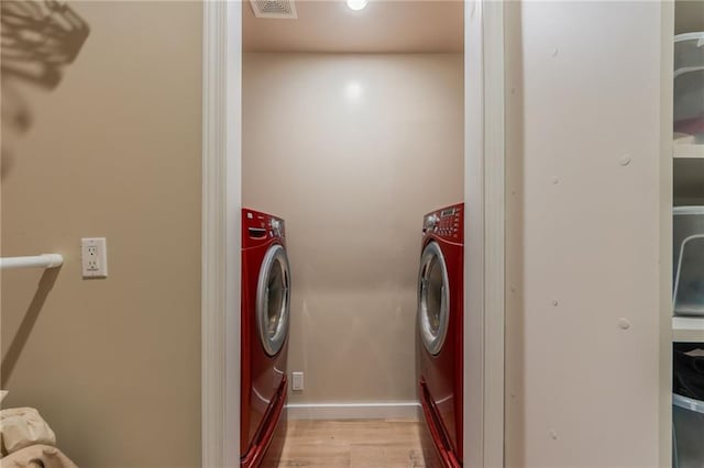 1955 Birmingham Rd, Liberty, MO 64068 - laundry room featuring washer and clothes dryer and light wood finished floors