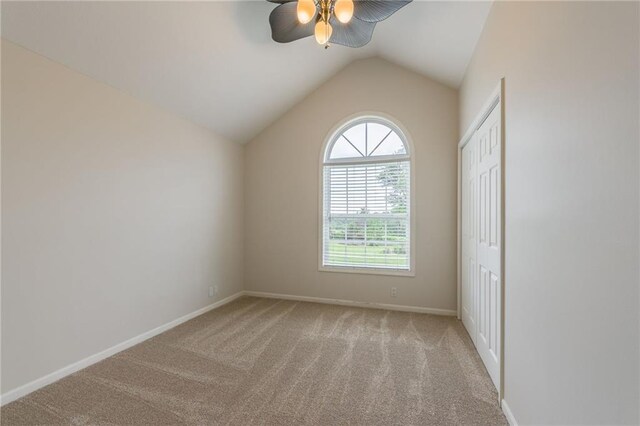 1955 Birmingham Rd, Liberty, MO 64068 - carpeted empty room featuring a ceiling fan and lofted ceiling