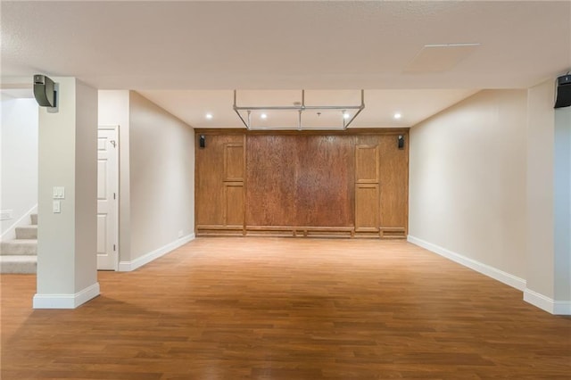 1955 Birmingham Rd, Liberty, MO 64068 - unfurnished room featuring wood finished floors, stairway, and recessed lighting