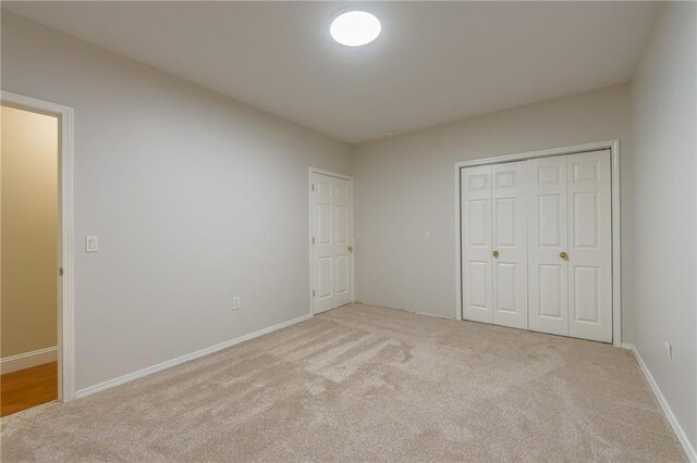 1955 Birmingham Rd, Liberty, MO 64068 - unfurnished bedroom featuring carpet flooring and a closet