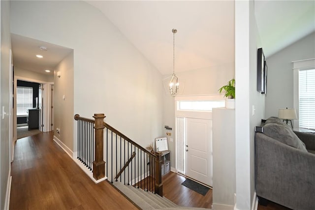 1905 Eagle Dr, Harrisonville, MO 64701 - foyer with lofted ceiling, a chandelier, wood finished floors, and baseboards