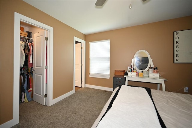 1905 Eagle Dr, Harrisonville, MO 64701 - carpeted bedroom featuring a walk in closet, baseboards, a ceiling fan, and a closet