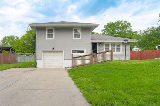 2917 N 83rd Ter, Kansas City, KS 66109 - split level home featuring an attached garage and concrete driveway