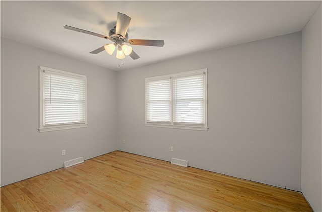 2917 N 83rd Ter, Kansas City, KS 66109 - spare room with plenty of natural light, wood finished floors, and a ceiling fan