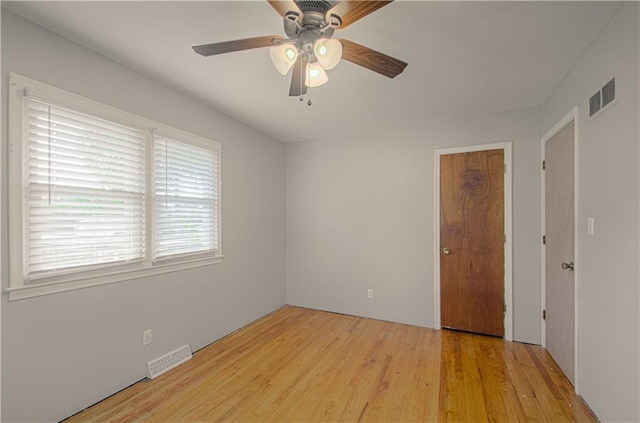 2917 N 83rd Ter, Kansas City, KS 66109 - unfurnished bedroom with light wood-type flooring and ceiling fan