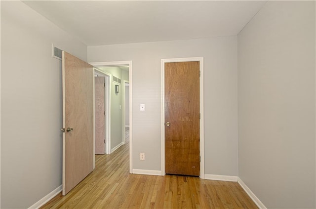 2917 N 83rd Ter, Kansas City, KS 66109 - unfurnished bedroom with light wood-style flooring and baseboards