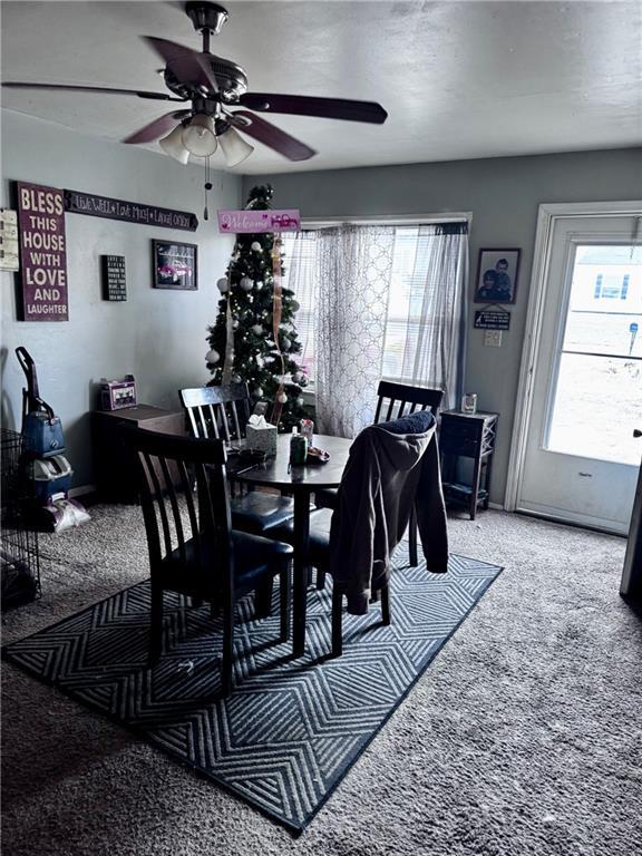 3301 Sioux Ln, Saint Joseph, MO 64503 - dining area with ceiling fan and carpet