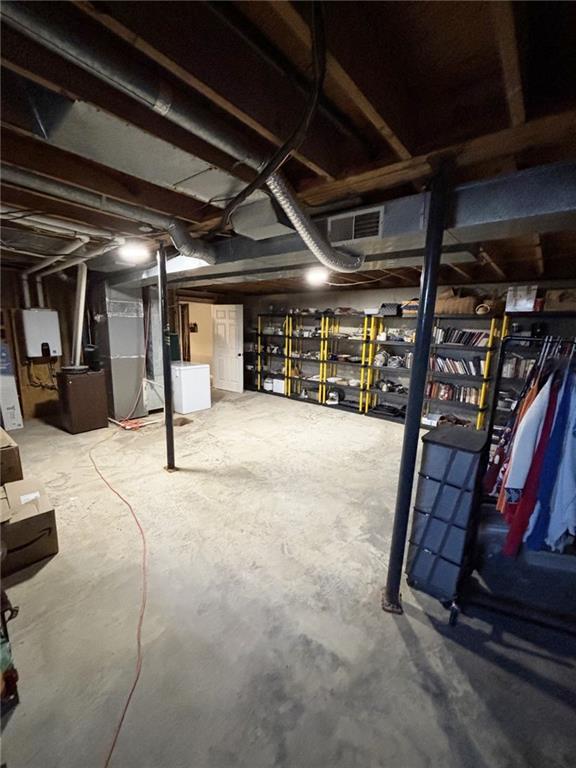 1205 W 14th Street Ct, Chanute, KS 66720 - unfinished below grade area featuring heating unit