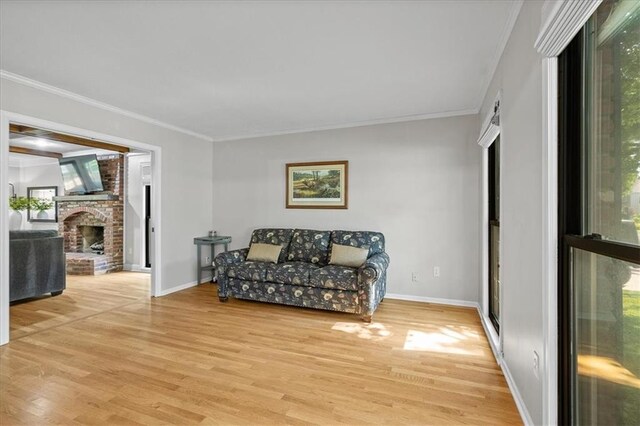 9327 Tomashaw Ln, Lenexa, KS 66219 - sitting room with light wood-style flooring, ornamental molding, and a fireplace