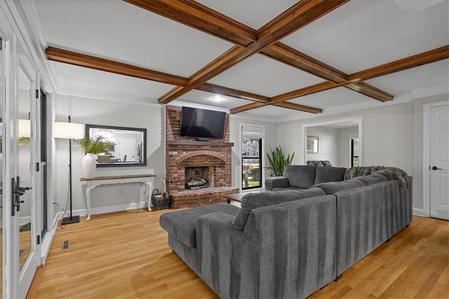 9327 Tomashaw Ln, Lenexa, KS 66219 - living room with light wood-type flooring, coffered ceiling, a brick fireplace, and beamed ceiling