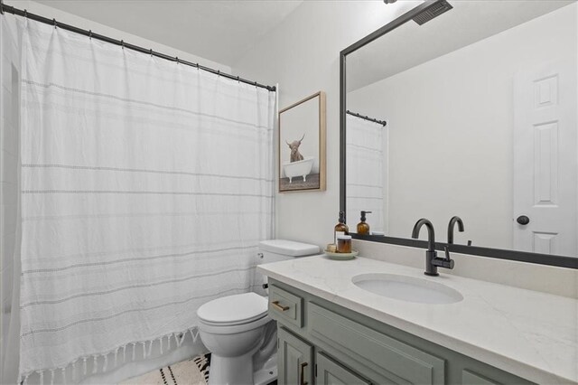 9327 Tomashaw Ln, Lenexa, KS 66219 - bathroom featuring vanity and shower / bathtub combination with curtain