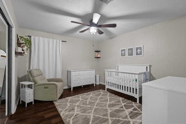 9327 Tomashaw Ln, Lenexa, KS 66219 - bedroom with wood finished floors, a crib, and a ceiling fan