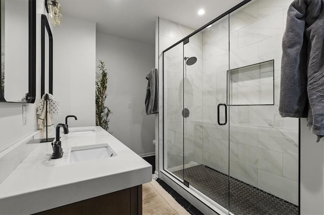9327 Tomashaw Ln, Lenexa, KS 66219 - full bathroom featuring double vanity, a stall shower, and recessed lighting