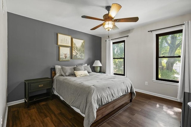 9327 Tomashaw Ln, Lenexa, KS 66219 - bedroom featuring dark wood-type flooring and ceiling fan