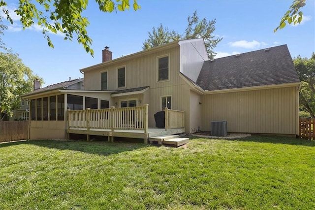 9327 Tomashaw Ln, Lenexa, KS 66219 - back of house with a chimney, a sunroom, a wooden deck, and roof with shingles