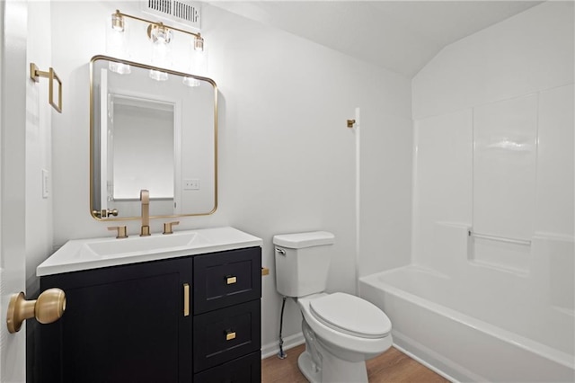 1932 N 80th Ct, Kansas City, KS 66112 - full bath featuring vanity, wood finished floors, lofted ceiling, and tub / shower combination