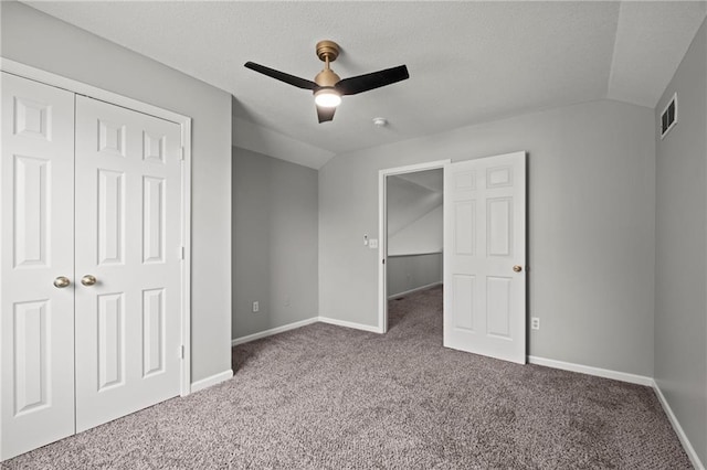 1932 N 80th Ct, Kansas City, KS 66112 - unfurnished bedroom with carpet, lofted ceiling, a closet, ceiling fan, and a textured ceiling