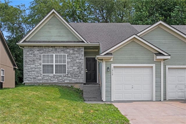 1932 N 80th Ct, Kansas City, KS 66112 - view of front of home featuring concrete driveway, stone siding, a front lawn, and a shingled roof