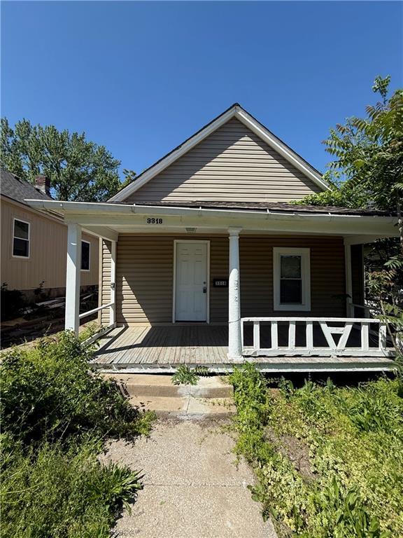 3318 E 24th St, Kansas City, MO 64127 - view of front of house with covered porch