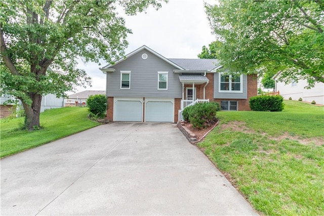 2802 N 39th Ter, Saint Joseph, MO 64506 - split foyer home featuring brick siding, driveway, a garage, and a front lawn
