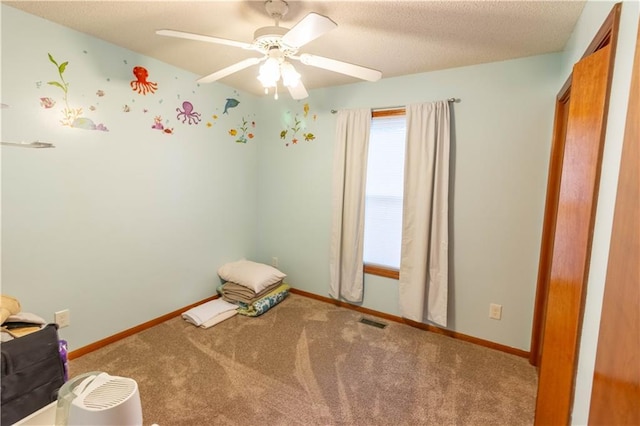 2802 N 39th Ter, Saint Joseph, MO 64506 - unfurnished bedroom featuring carpet flooring, baseboards, and a ceiling fan