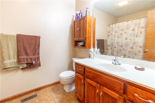 2802 N 39th Ter, Saint Joseph, MO 64506 - full bathroom with vanity, toilet, tile patterned floors, baseboards, and a shower with shower curtain