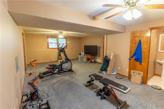 2802 N 39th Ter, Saint Joseph, MO 64506 - workout area with ceiling fan, a textured ceiling, carpet flooring, and baseboards