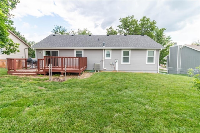 2802 N 39th Ter, Saint Joseph, MO 64506 - rear view of property with a yard, a deck, and a shingled roof