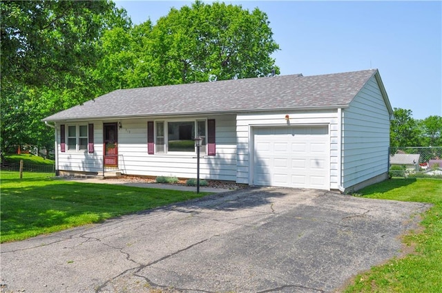 913 N Maple St, Stanberry, MO 64489 - ranch-style house featuring a garage, asphalt driveway, and a shingled roof