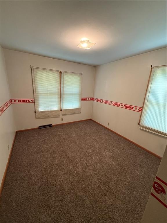 913 N Maple St, Stanberry, MO 64489 - carpeted spare room featuring baseboards