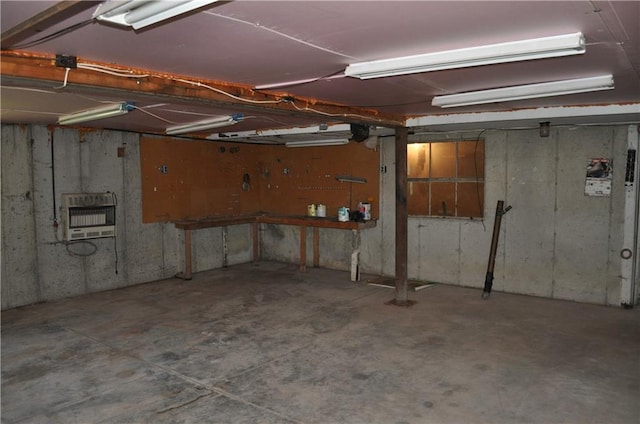 913 N Maple St, Stanberry, MO 64489 - below grade area with heating unit, a garage, and a workshop area