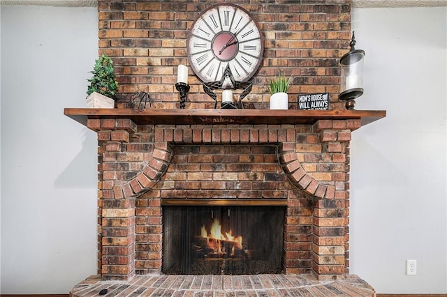 63 Maple Dr, Platte City, MO 64079 - detailed view of a brick fireplace and baseboards