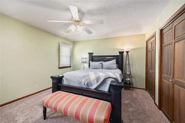 63 Maple Dr, Platte City, MO 64079 - bedroom with carpet floors, two closets, a textured ceiling, and a ceiling fan