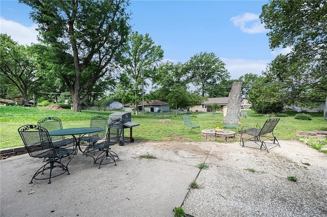 63 Maple Dr, Platte City, MO 64079 - view of patio / terrace featuring an outdoor fire pit, grilling area, and outdoor dining area
