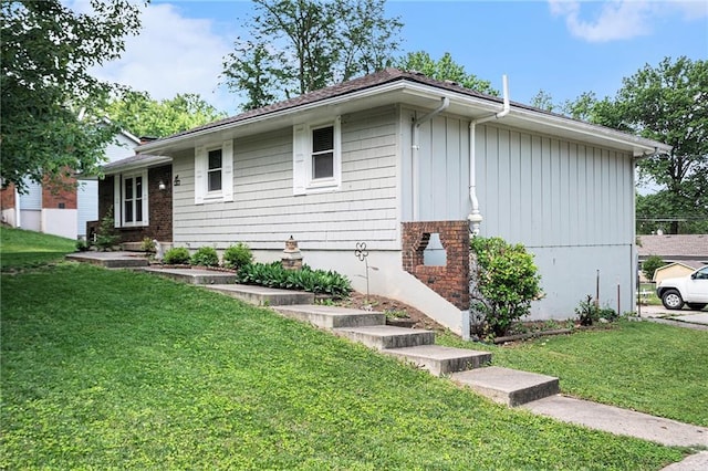 63 Maple Dr, Platte City, MO 64079 - view of home's exterior featuring a yard and board and batten siding