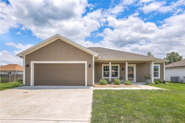 217 S Devin St, Lone Jack, MO 64070 - ranch-style house with driveway, a garage, a porch, and cooling unit