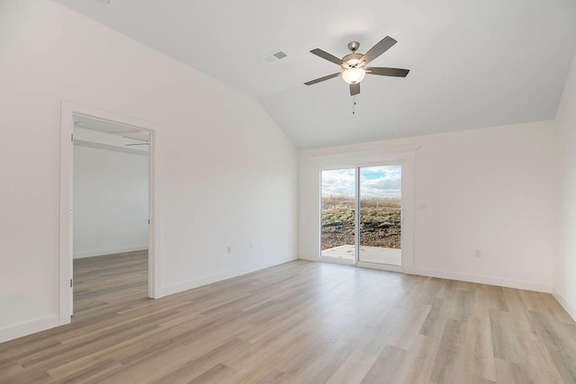 3818 NW 93rd St, Kansas City, MO 64154 - spare room featuring light wood-style flooring, lofted ceiling, a ceiling fan, and baseboards