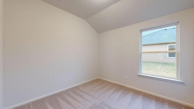 551 W Lanesfield St, Gardner, KS 66030 - empty room featuring light carpet, lofted ceiling, plenty of natural light, and baseboards