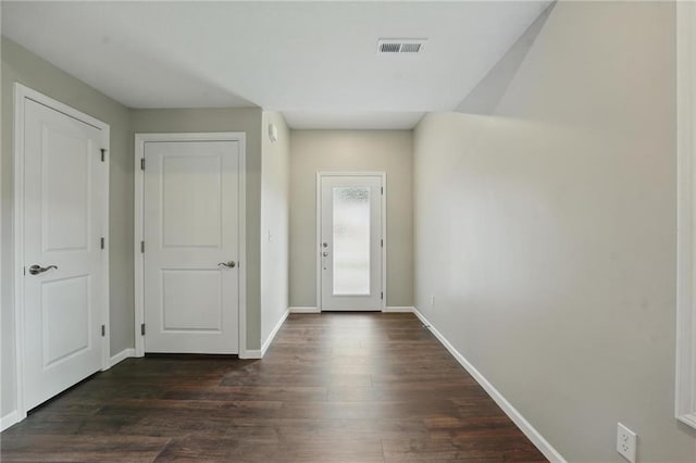 809 Highland Dr, Edwardsville, KS 66111 - entryway with baseboards and dark wood-style flooring