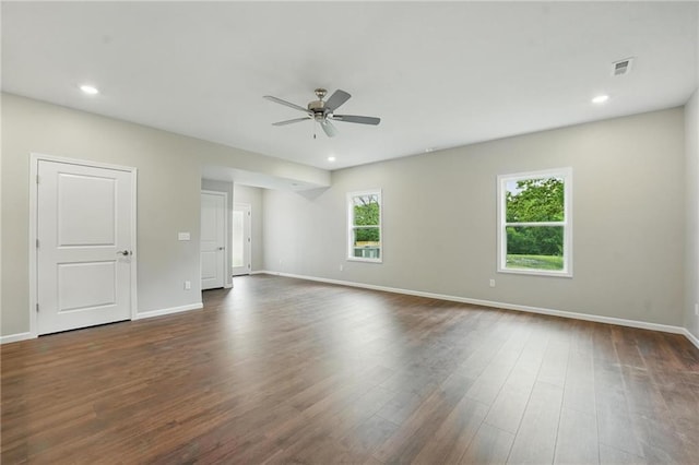 809 Highland Dr, Edwardsville, KS 66111 - unfurnished room with ceiling fan, baseboards, dark wood-type flooring, and recessed lighting